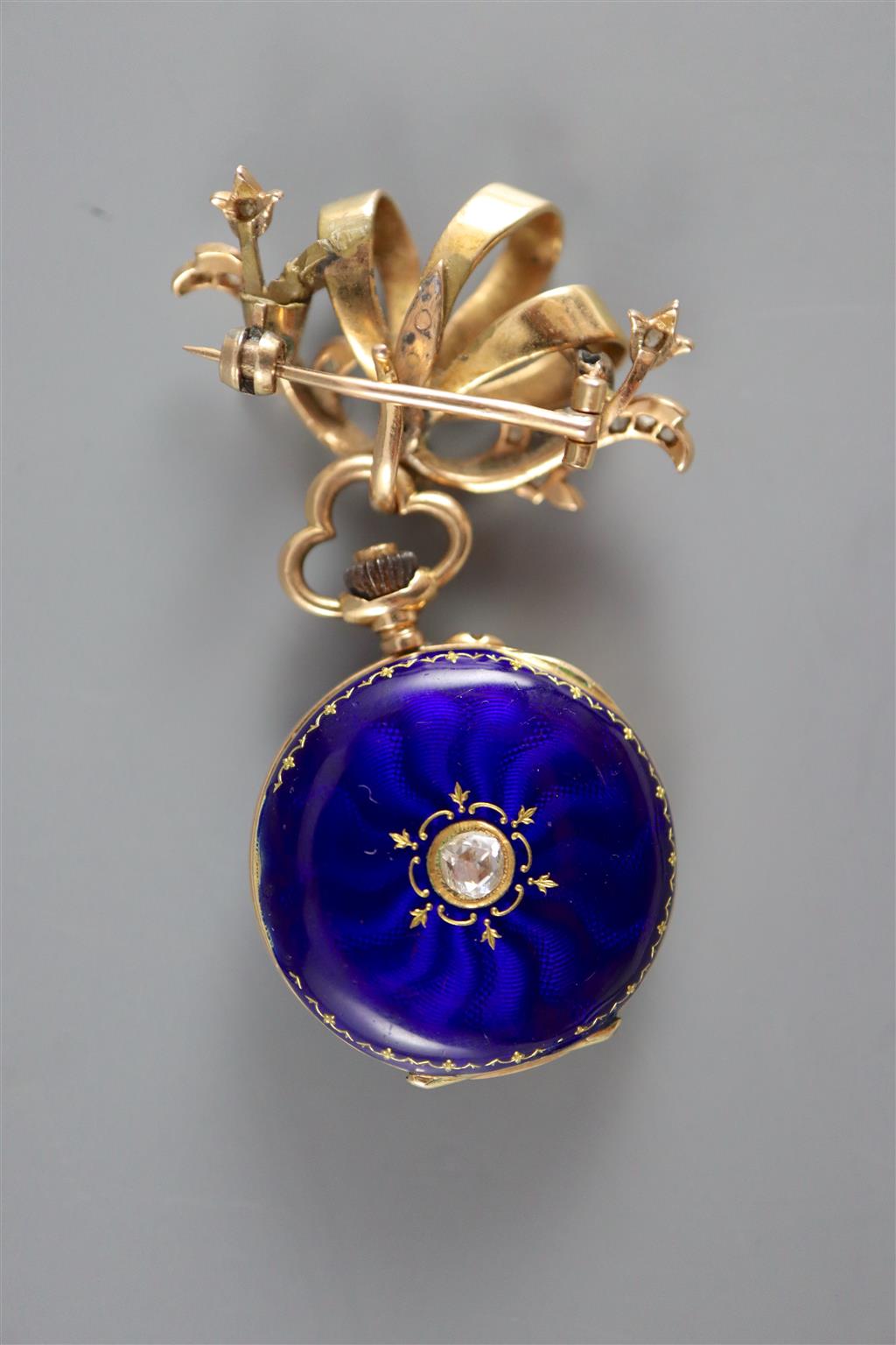 An early to mid 20th century LeCoultre & Co 18k, blue enamel and rose cut diamond set fob watch and similar brooch suspension,